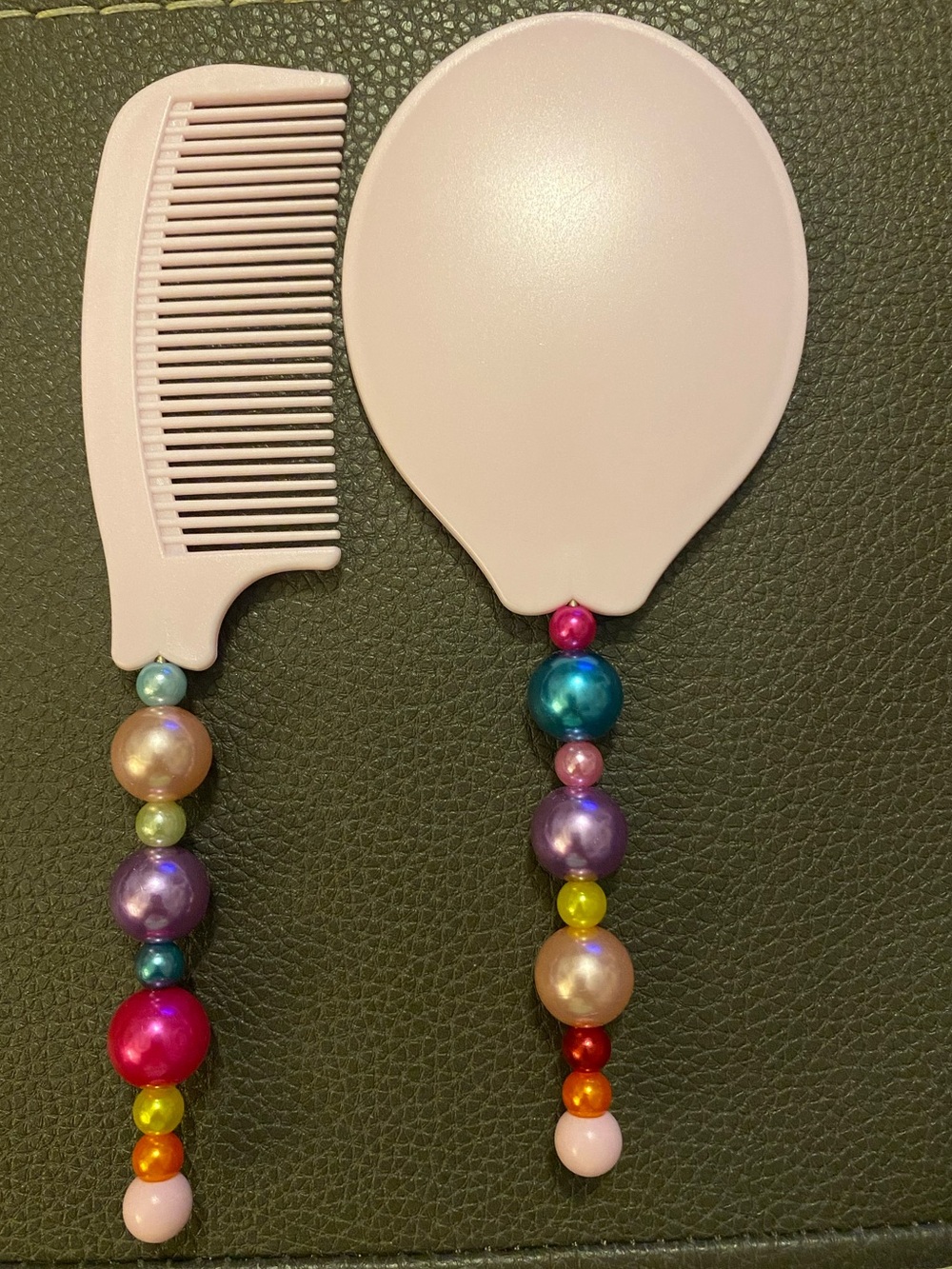 Pink Beaded Handle Hairbrush and Comb Set.